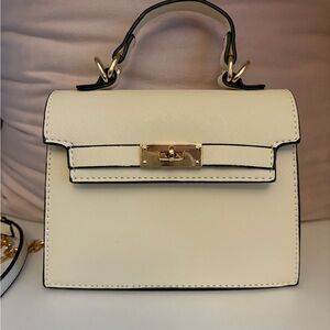 Cream clutch and crossbody bag with gold accents